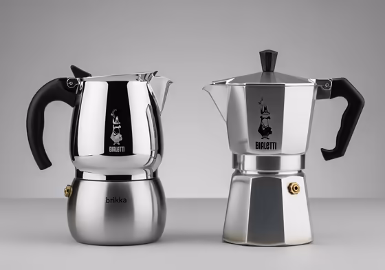A Bialetti Brikka and a classic Bialetti Moka Express standing side-by-side for comparison.