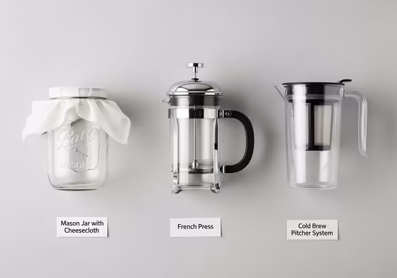 A side-by-side comparison of different cold brew makers: a simple Mason jar, a French press, and a specialized Toddy cold brew system.