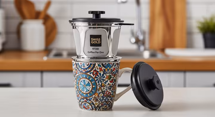 The Swiss Gold KF300 one-cup coffee filter system assembled and sitting on a coffee mug.